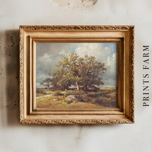 Framed landscape painting on a textured wall, depicting a large tree under a cloudy sky. Text "PRINTS FARM" is vertically aligned beside the frame.