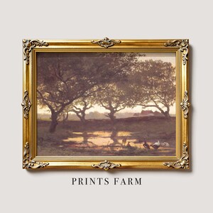 Framed painting of a serene farm landscape at sunset. Trees cast long shadows over a pond while ducks gather at the water's edge. Peaceful and rustic ambiance.