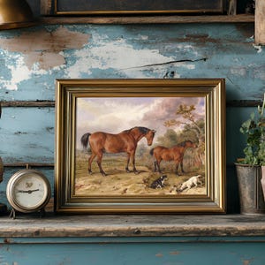 A framed painting of horses and dogs sits on a rustic, weathered blue shelf. Beside it, there's an antique clock and lush potted plants.