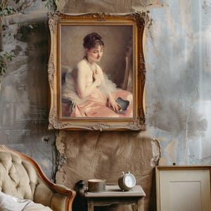 Framed vintage painting of a seated woman in a pink dress on textured wall. Cozy antique room with a beige armchair, clock, and tall lamp. Classic and serene.