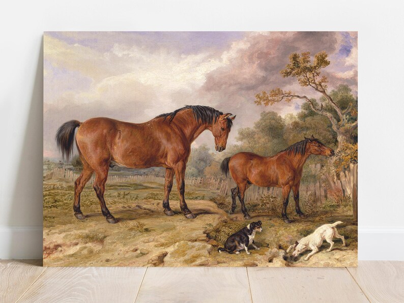 Two brown horses stand on a grassy path, with two playful dogs nearby. The background features a wooden fence, trees, and a partly cloudy sky.