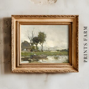 Framed landscape painting of a tranquil countryside with a cottage, trees, and a serene pond. The frame is ornate, and "PRINTS FARM" is written beside it.