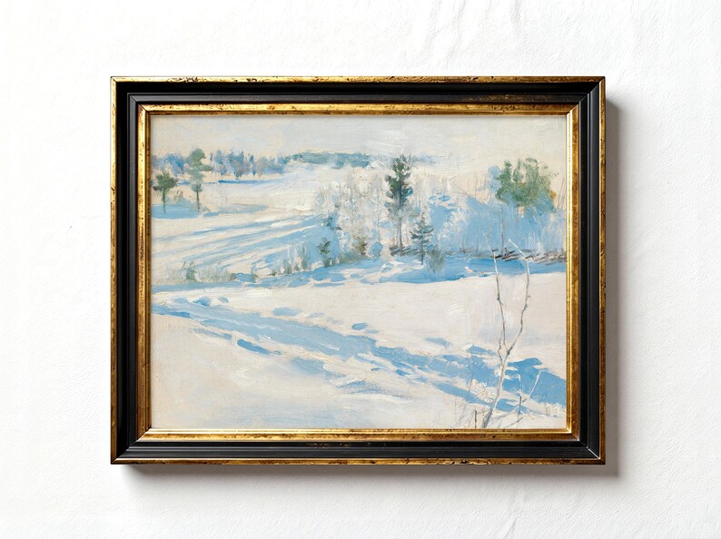 A framed painting depicts a serene winter landscape with snow-covered fields and distant trees under a soft blue sky, conveying tranquility.