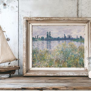 A rustic scene with a model sailboat, an Impressionist painting of a lakeside landscape in a weathered frame, and a jar of sand on a wooden shelf.