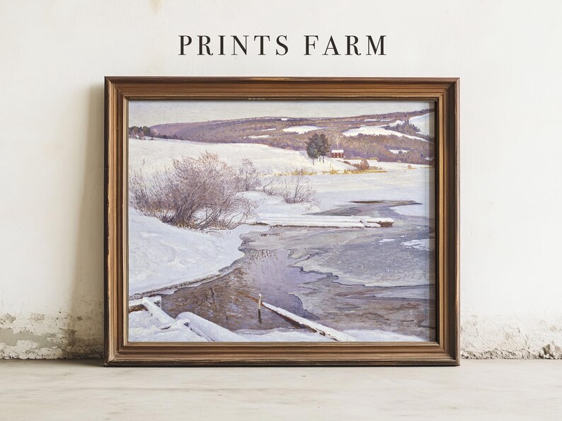 Framed winter landscape painting with snowy hills and a river under a cloudy sky. Calm, serene scene. "Prints Farm" text is above.