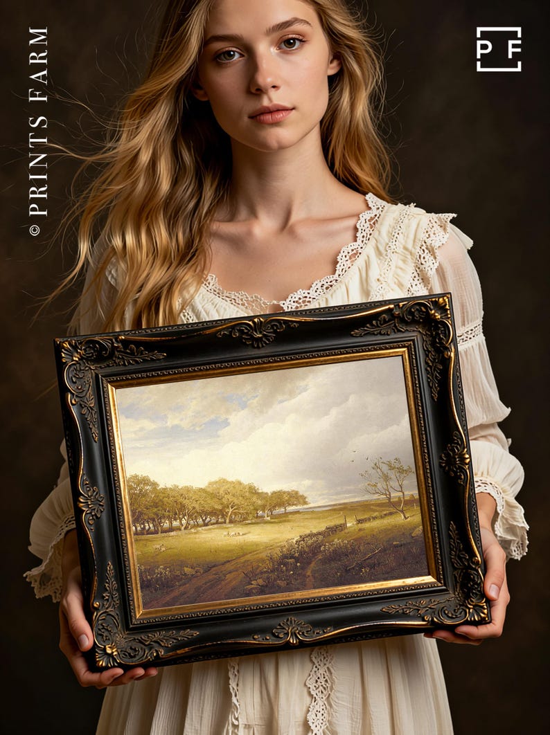 A woman in a lace dress holds an ornate framed landscape painting depicting trees and a cloudy sky. The mood is serene and classic.