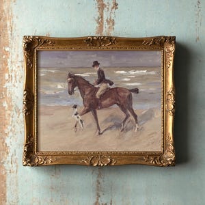 Painting of a rider on a horse by the sea, accompanied by a dog, in an ornate gold frame against a distressed wooden wall. Tranquil and nostalgic.