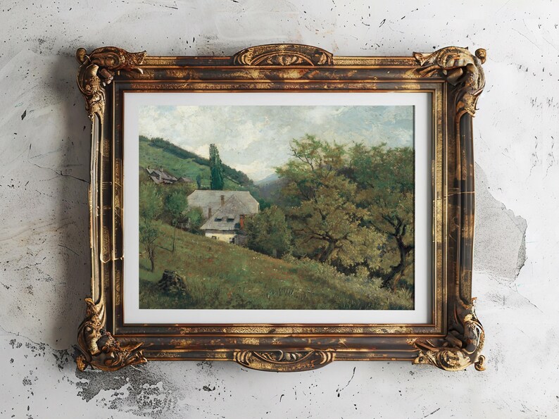 Vintage landscape painting in an ornate brown and gold frame. It depicts a rural scene with a house, lush greenery, and rolling hills under a cloudy sky.