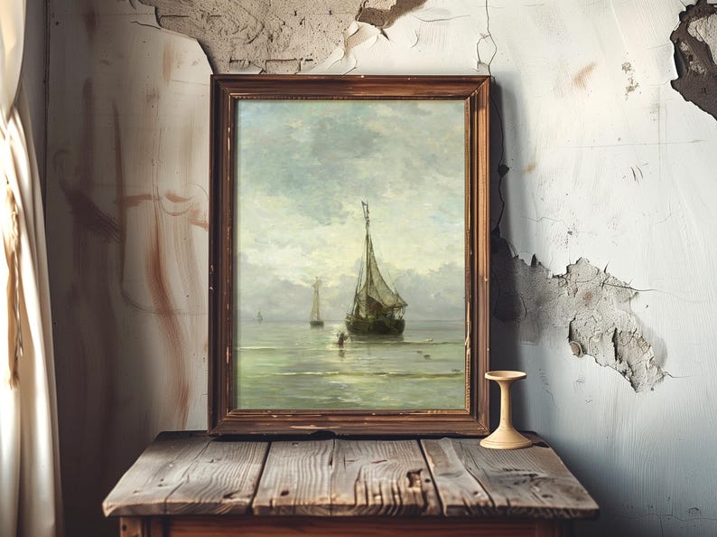 A framed painting of a sailboat on a calm sea leans against a peeling, cracked wall. The scene exudes a sense of nostalgia and tranquility.
