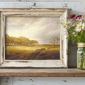 A rustic scene with a weathered wooden shelf holds a vintage landscape painting in a distressed frame. Beside it, a mason jar with vibrant wildflowers.