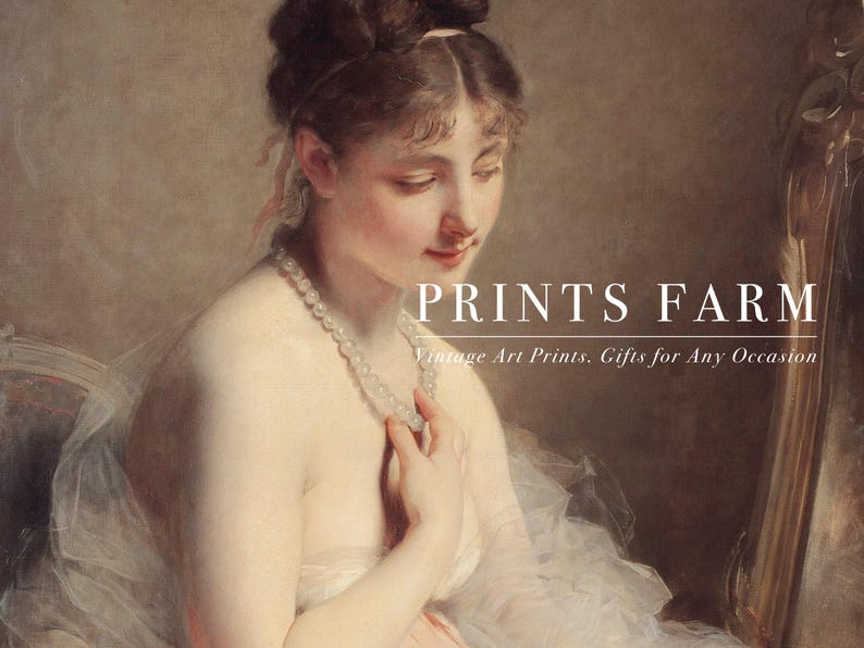 Framed portrait of a woman in a pink dress sits on a fluffy white rug. Beside it, a white vase holds dried pampas grass, creating a serene, elegant scene.