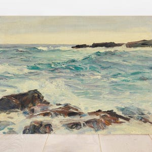 Painting of a seascape with turbulent waves crashing against dark rocks. The sky is overcast, with a calm, muted color palette conveying a serene mood.