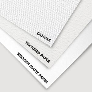Three overlapping paper types are shown: a textured canvas on top, medium-texture paper in the middle, and smooth matte paper at the bottom, labeled accordingly.