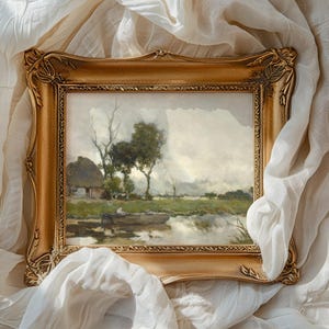A framed landscape painting with trees and a small cottage is set against flowing white fabric. The scene conveys a serene, nostalgic mood.