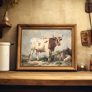 A cozy kitchen with a framed cow painting on a wooden shelf. Nearby are jars of dried goods and vibrant oranges, evoking a rustic, warm ambiance.