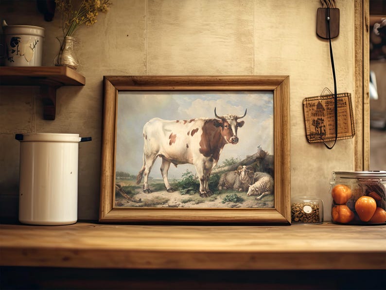 A cozy kitchen with a framed cow painting on a wooden shelf. Nearby are jars of dried goods and vibrant oranges, evoking a rustic, warm ambiance.