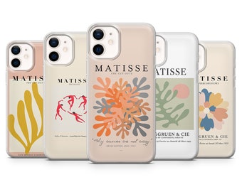 May include: Five different phone cases featuring abstract art prints by Henri Matisse. The cases are clear and show the artwork through the plastic. The artwork includes a yellow and orange coral design, a red and orange dance scene, a coral design in orange, pink, and gray, a green and pink coral design, and a blue and yellow floral design. The cases all have the artist's name and the title of the artwork printed on them.