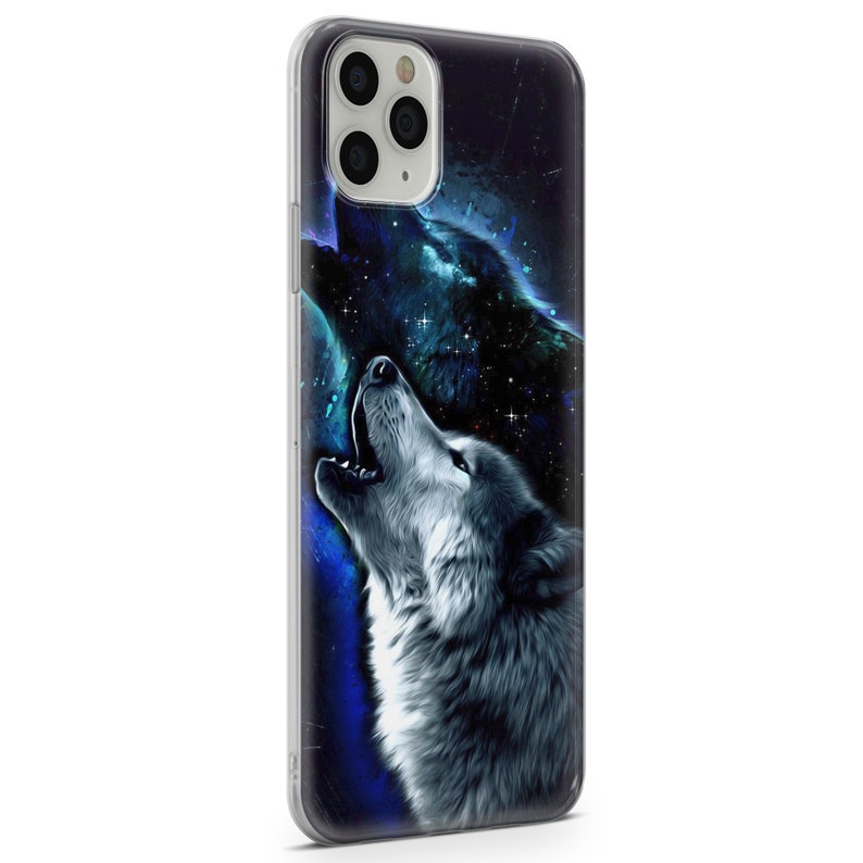 May include: A clear phone case with a design of two wolves howling at the moon. The wolves are silhouetted against a starry night sky. The case is compatible with iPhone models.