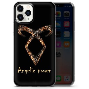 May include: A black phone case with a gold and black angelic symbol and the text "Angelic power".