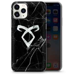 May include: A black and white marble phone case with a white rune symbol. The rune symbol is a white triangle with two curved lines on either side.