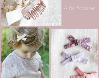 Set of three handmade gentle bow hair clips for babies and toddlers with fine hair in Liberty of London cotton fabric