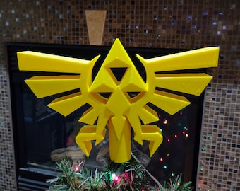 Adorno para la punta del árbol de Navidad con el escudo de la Trifuerza impreso en 3D e iluminación
