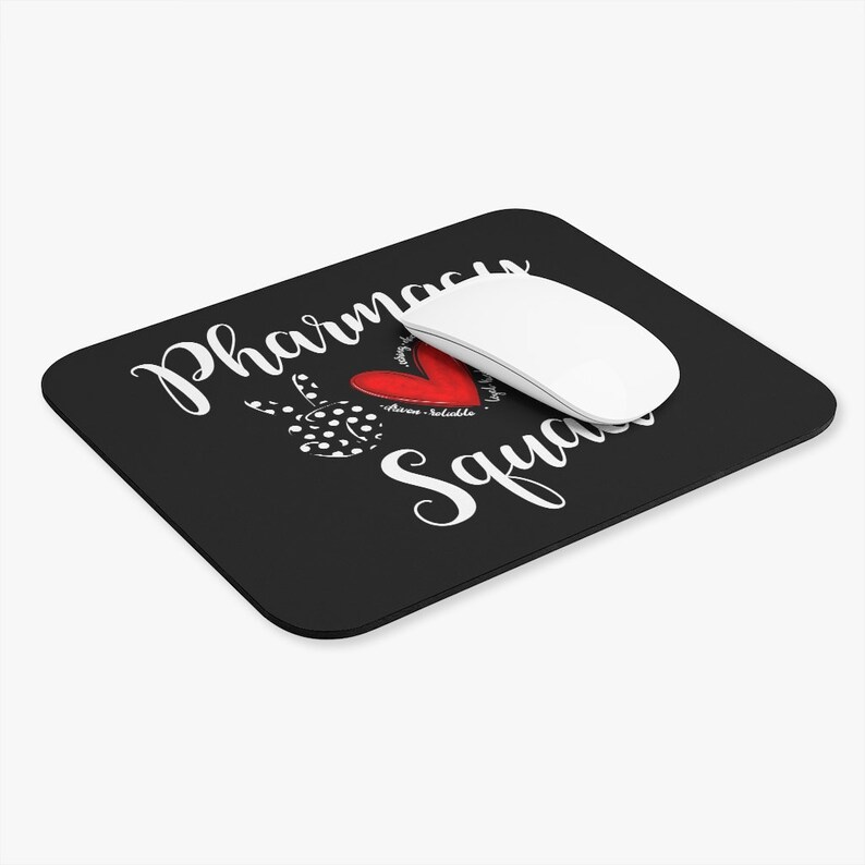 May include: Black mouse pad with white text that reads "Pharmacy Squad" and a red heart with white polka dots.