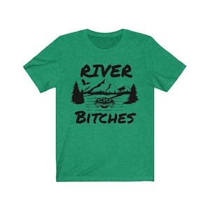 May include: Green short-sleeved t-shirt with a black graphic of a mountain range, a river, and a boat with the text "River Bitches".