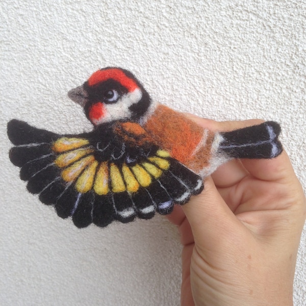 Goldfinch in flight a brooch made of felted wool