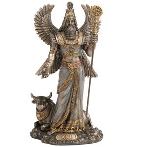May include: A detailed statue of Anu, a Mesopotamian deity, with outstretched wings and a long beard. The figure is adorned in gold and blue robes, holding a staff with a sun emblem. A bull rests at the figure's feet. The base of the statue reads "ANU".