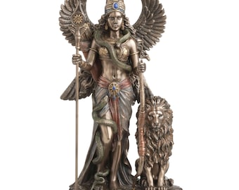 May include: Bronze-toned statue of a winged figure, holding a staff and a scepter. A serpent is wrapped around the figure's body. A lion sits at the figure's feet. The statue is labeled "INANNA" at the base.