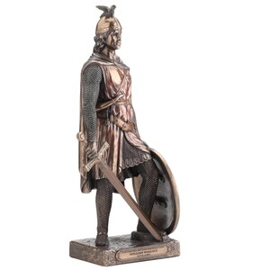 May include: A bronze statue of William Wallace, a historical figure, in full armour. The statue shows Wallace with a sword, shield, and helmet, standing on a rectangular base. The base has an inscription with his name and dates.