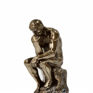 May include: A bronze sculpture of a man sitting in a contemplative pose, known as "The Thinker". The sculpture is detailed and realistic, capturing the man's thoughtful expression.