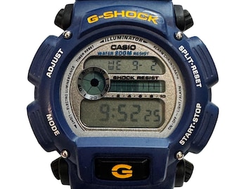 Blue Casio G-Shock DW-9052-2V digital watch featuring a durable resin case and a clear digital display