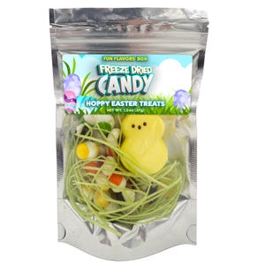 May include: A silver resealable bag filled with freeze-dried candy. The candy is a mix of yellow, orange, white, and green pieces. The bag has a label that says "Fun Flavors Box Freeze Dried Candy Hoppy Easter Treats Net Wt. 1.3 oz (37g)"