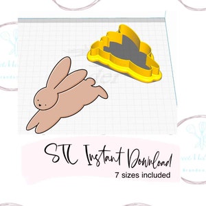 Puede incluir: Una descarga digital de un cortador de galletas de conejo en siete tamaños diferentes. La imagen muestra un cortador de galletas de conejo marrón con un contorno amarillo.