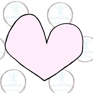 May include: A pink heart-shaped cookie cutter with a black outline.