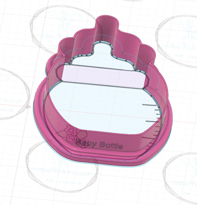 May include: Pink plastic baby bottle cookie cutter with a floral design and the text "Baby Bottle" on the bottom.
