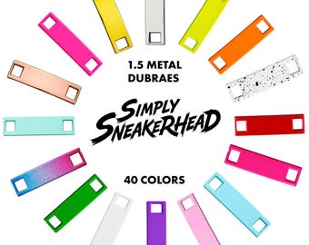 May include: A collection of rectangular metal sneaker dubraes arranged in a circle, featuring various solid colours, a speckled pattern, and a gradient finish. Text in the centre reads 1.5 METAL DUBRAES, SIMPLY SNEAKERHEAD, and 40 COLOURS.