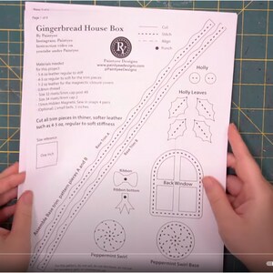 May include: A printed paper pattern for a Gingerbread House Box, featuring detailed line drawings of various components like holly leaves, a back window, and peppermint swirls. The pattern includes text and a size reference of one inch.