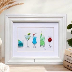 May include: A framed artwork featuring five distinct cocktails arranged in a row. The drinks include a blue short glass with lime, a martini with olives, a blue stemmed glass with a cherry, a tall green drink with lime, and a wine glass with red roses.