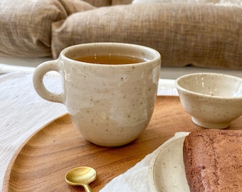 Handmade beige speckled mug with handle stoneware ceramic tableware