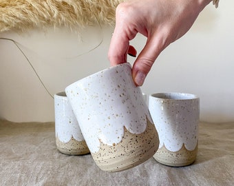 Raw speckled white scalloped tea mug in ceramic, handmade stoneware tableware