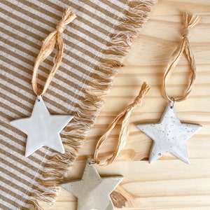 Star with light orange recycled silk ribbon in handmade stoneware ceramic