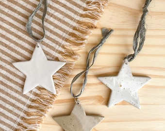 Star with light gray recycled silk ribbon in handmade stoneware ceramic