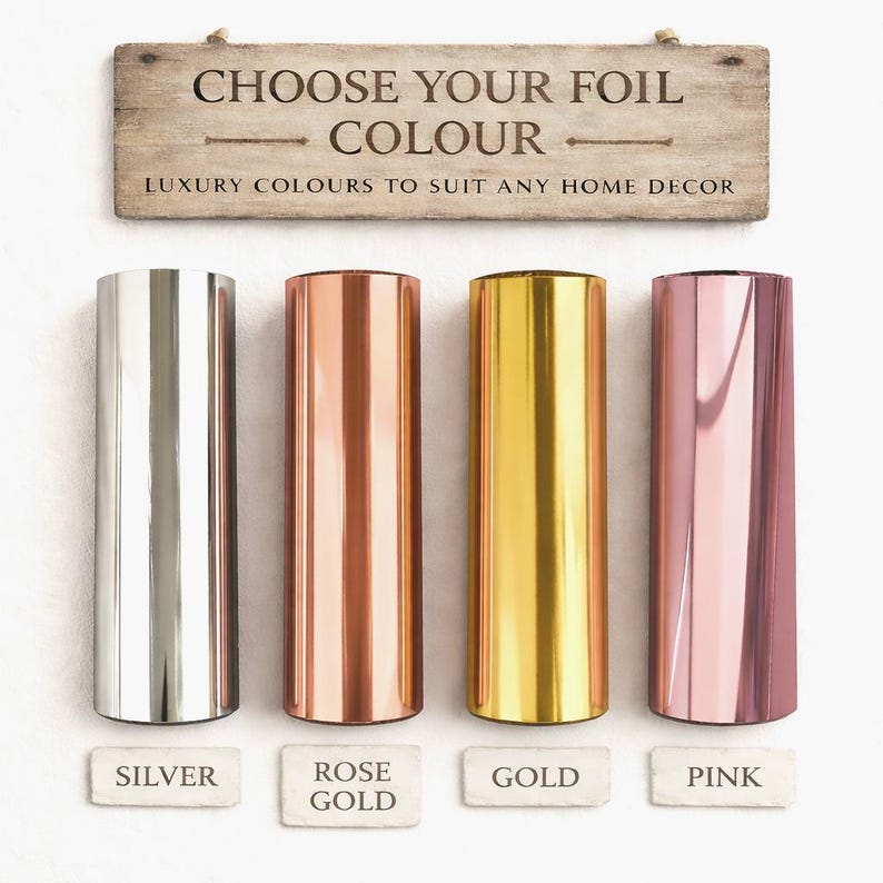 four different colored foils, each labeled with a color: silver, rose gold, gold, and pink. Above the foils, there is a wooden sign that reads "Choose your Foil Colour" and below the foils, there are labels for each color: silver, rose gold, gold, and pink.