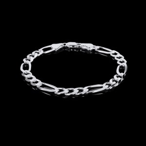 May include: A silver chain bracelet with a classic figaro link design.