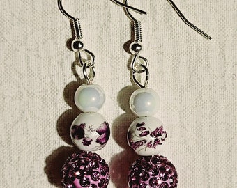 83) Beautiful opalescent white, lavender and white, and sparkly purple beads