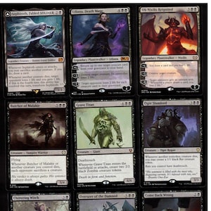 May include: Nine Magic: The Gathering trading cards are displayed. The cards feature fantasy art and text, with titles like "Sephiroth, Fabled SOLDIER" and "Liliana, Death Mage." The cards are predominantly black, white, and shades of grey.