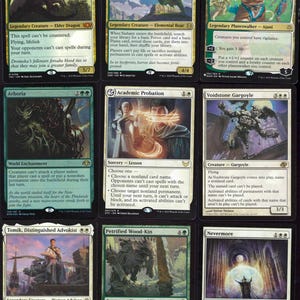 May include: Nine Magic: The Gathering trading cards. The cards feature various creatures and spells, including a dragon, a boar, and a planeswalker. The cards have different mana costs and abilities, with vibrant artwork and text descriptions.